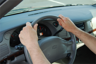 Hands on a steering wheel